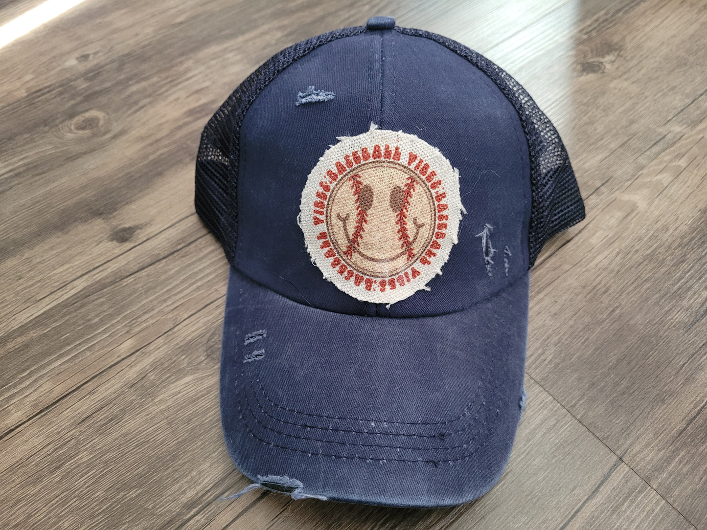 Baseball Vibes Crisscross ponytail adjustable Navy hat.